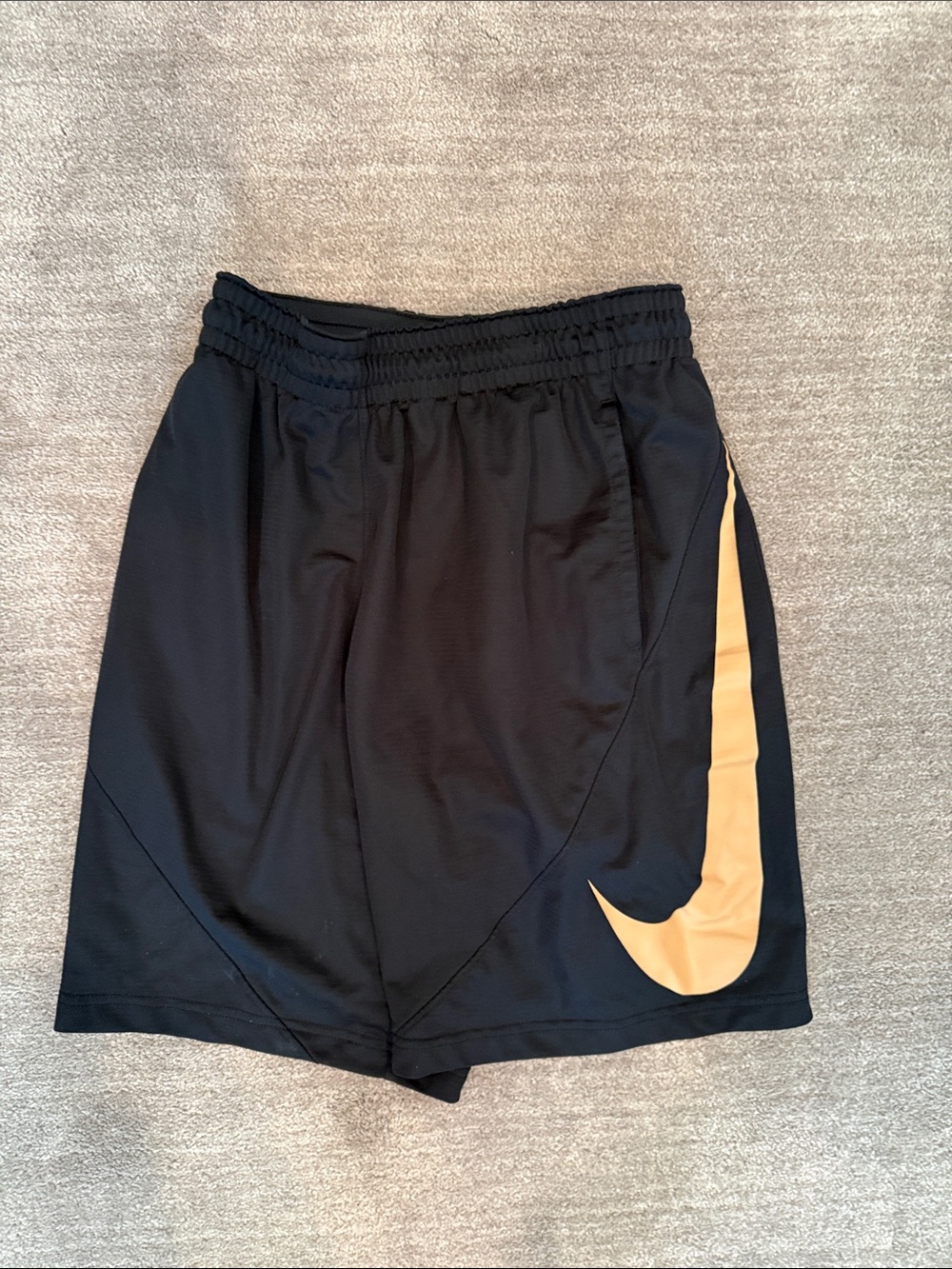 Nike Black Shorts with Gold Swoosh Accent